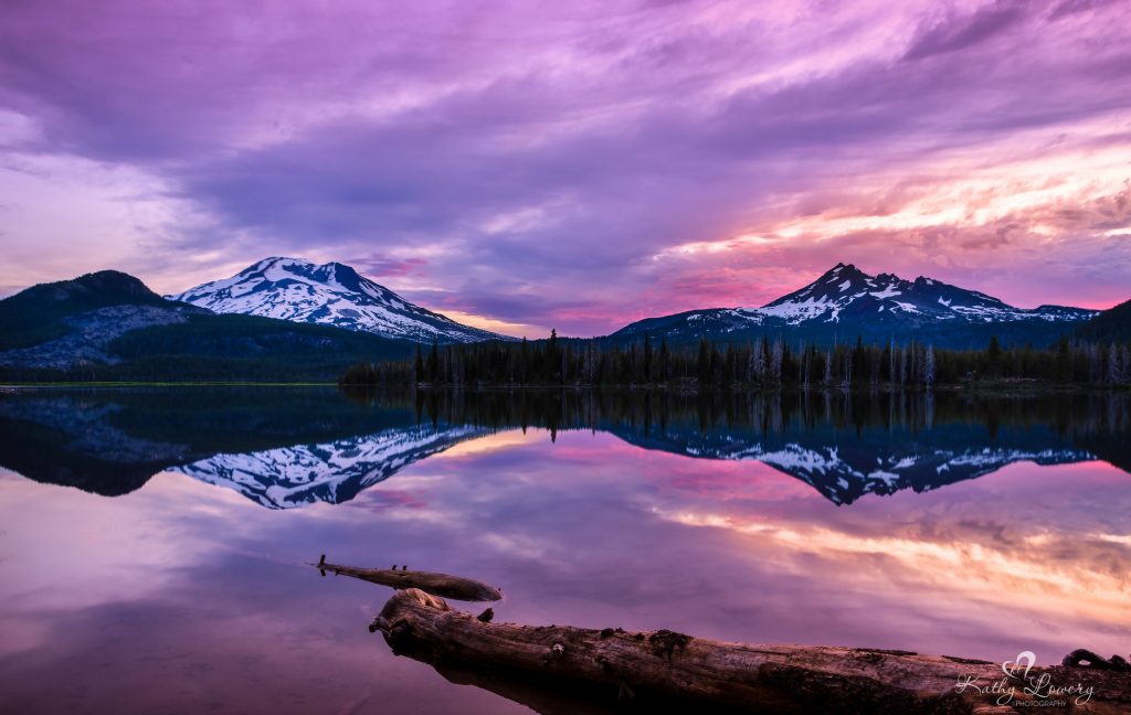 A gorgeous purple and pink sunset reflected in the waters of Sparks Lake.