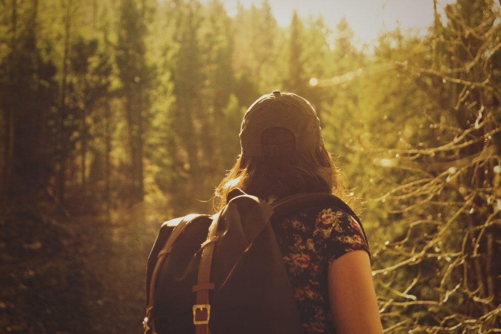 hikes in oregon woman with backpack in the forest