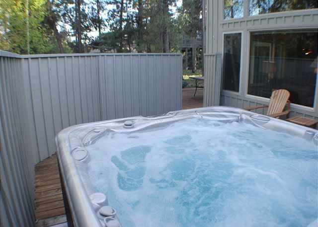 A hot tub at a rental cabin through Sunset Lodging in Sunriver.
