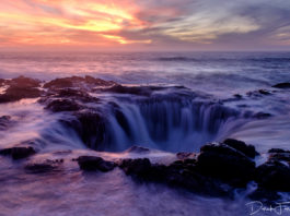 Thor's Well at sunset. It looks like there's a massive hole in the ocean draining all the water.