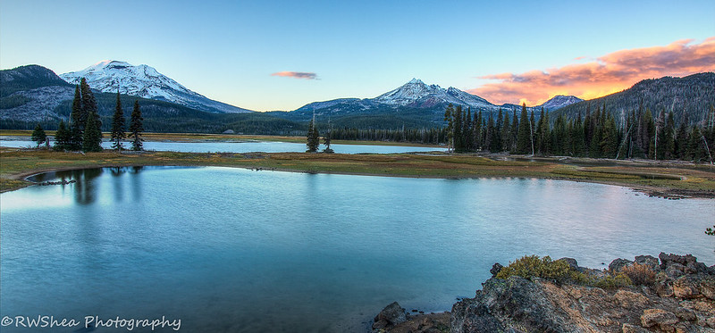 Sparks Lake on a sunny day.  It's near sunset and the clouds are tinged a pretty pink.