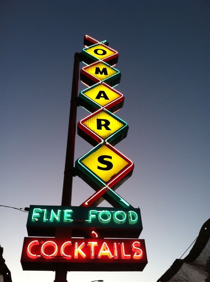 the old lit up Omar's restaurant sign