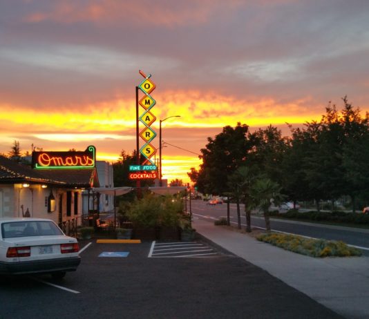 the outside of Omar's restaurant at sunset