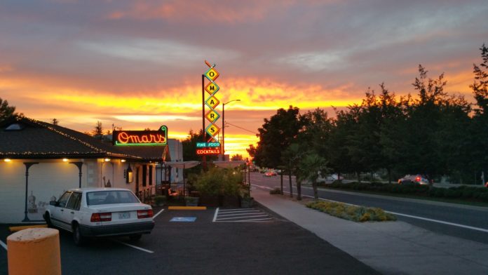 the outside of Omar's restaurant at sunset
