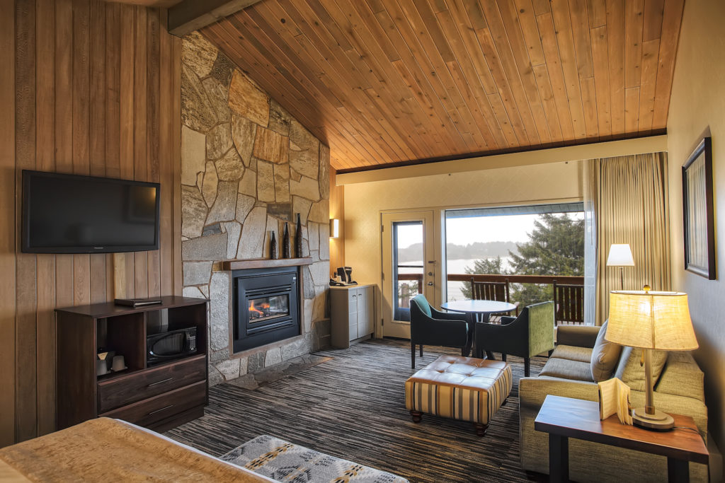 A luxurious room with a fireplace at Salishan Coastal Lodge