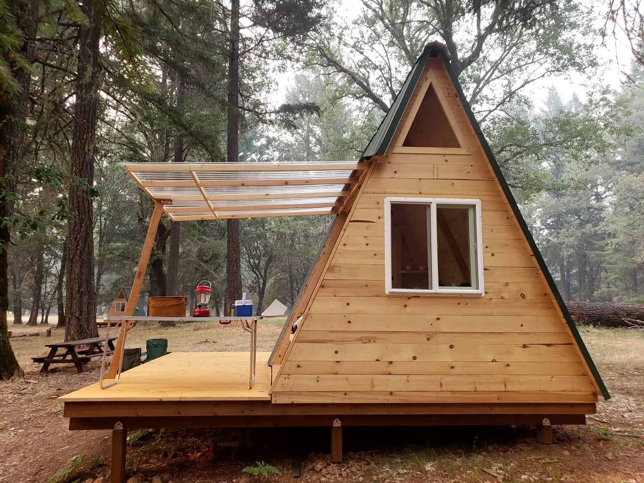 A pretty and tiny A frame cabin in the woods
