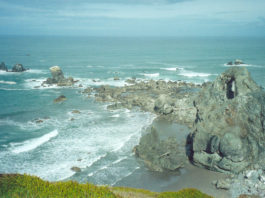 Blue ocean and gray cliffs at Blacklock Point.