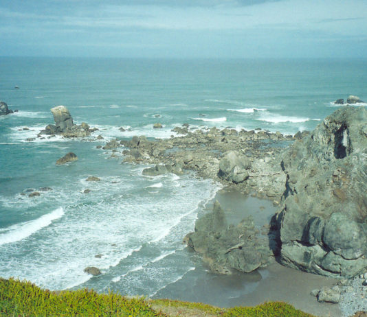 Blue ocean and gray cliffs at Blacklock Point.