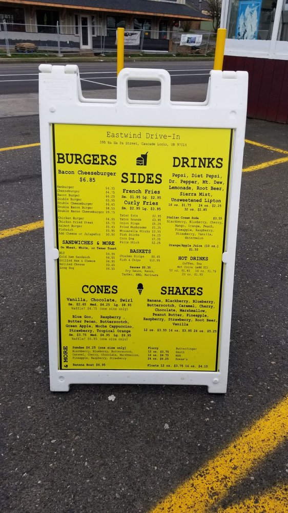 The bright yellow Eastwind Drive-In Menu.