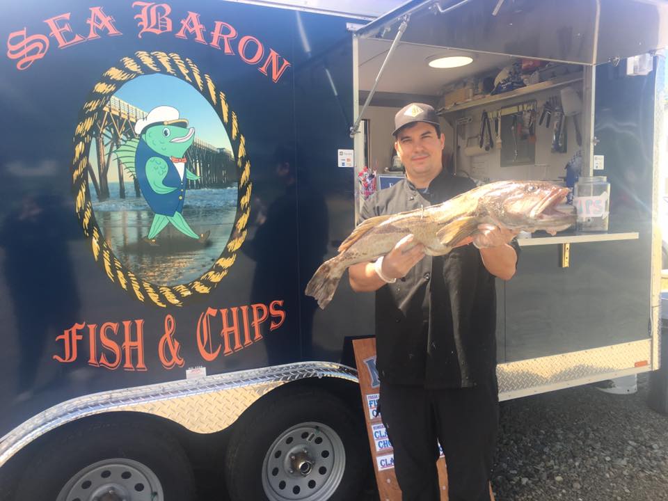 Fresh fish being held up outside The Sea Baron.