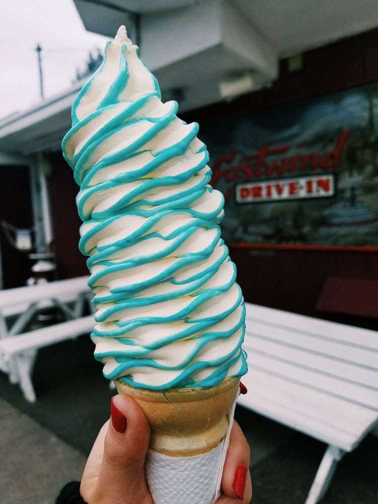 A really tall blue and white ice cream cone.