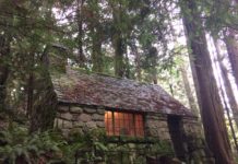 A stone cabin in the forest.