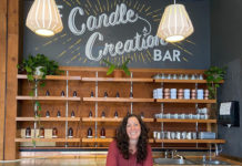 A woman at the candle creation bar at Yo Soy