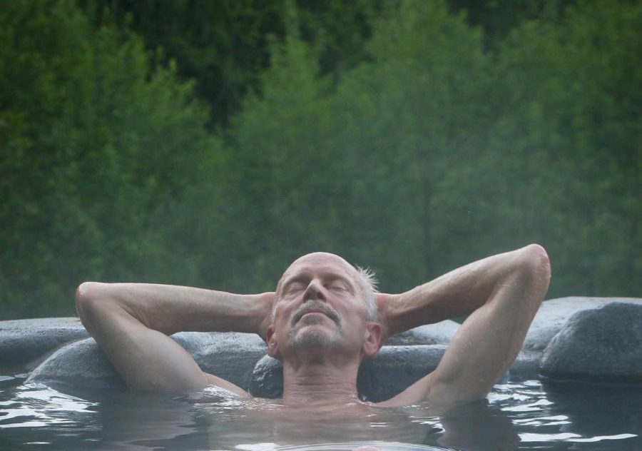 a man soaking in oregon hot springs