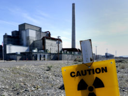 hanford washngton reactor with yellow radiation sign