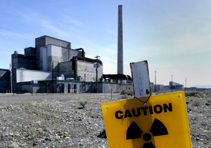 hanford washngton reactor with yellow radiation sign