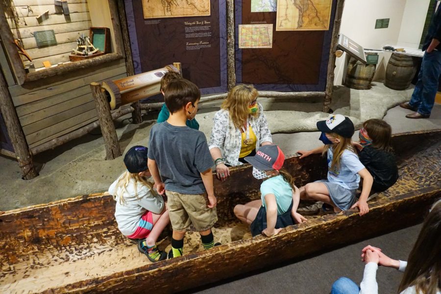 columbia gorge discovery center wasco county museum children sit in a dugout canoe