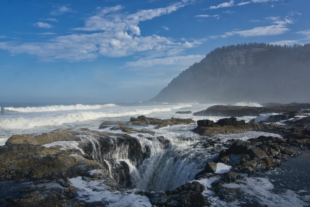 Thor's Well is depicted at low tide, with water flowing into the hole