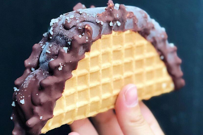 The tacolate, a waffle cone taco shell covered in chocolate, filled with ice cream