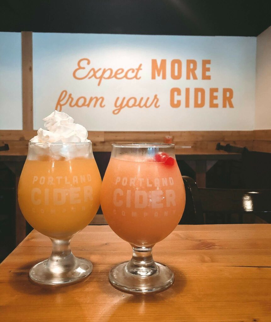 Portland Cider Co slushies in front of sign reading, "Expect more from your cider"