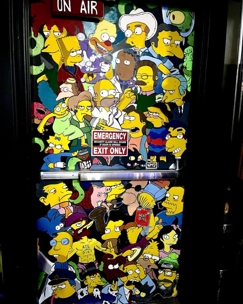 Door with heads of Simpsons characters in Next Level Pinball in Hillsboro Oregon