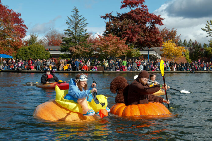 People paddling gigantic pumpkins in Tualatin Oregon