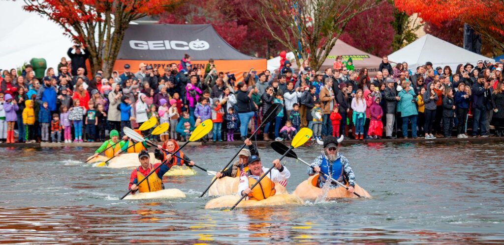 People paddling gigantic pumpkins in Tualatin Oregon