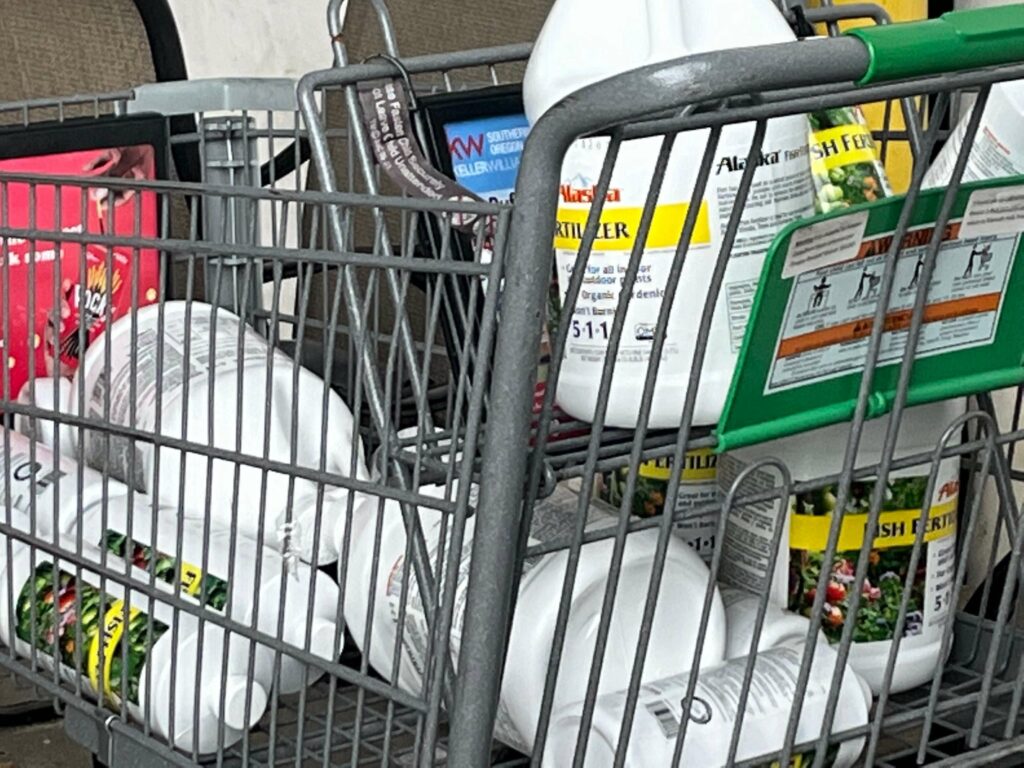 Shopping cart filled with bottles of Alaska 5-1-1 at Fred Meyer in Klamath Falls