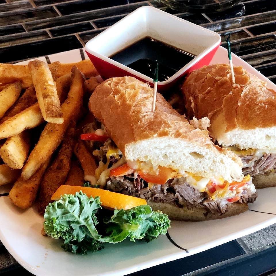 A delicious meat sandwich with fries and au jus dip at Smoky Hearth in Sandy, Oregon