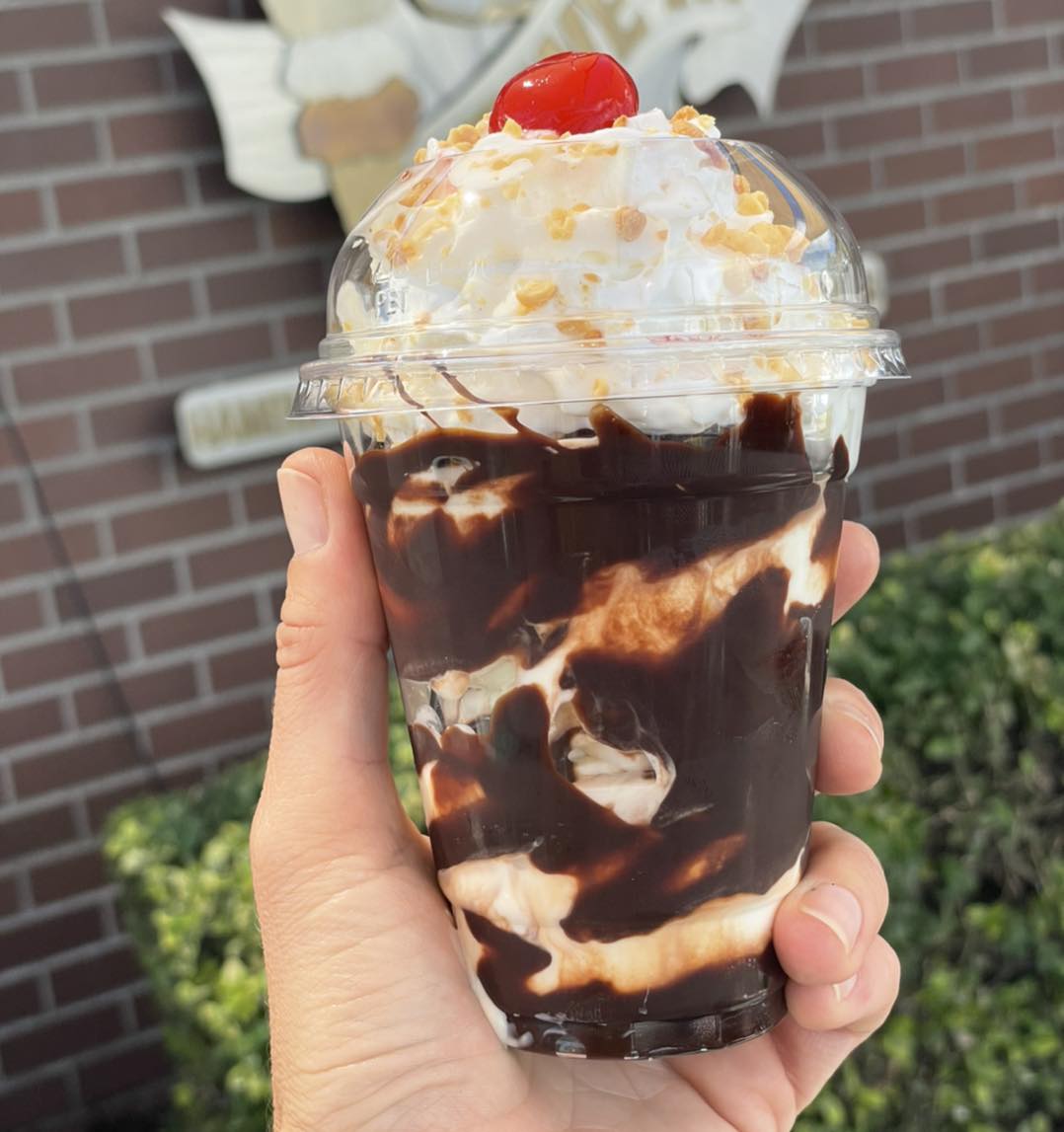A chocolate milkshake with whip cream and a cherry on top from Big Jim's Drive In.
