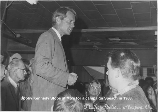 A black and white photo of Robert Kennedy at Mo's restaurant in 1968.
