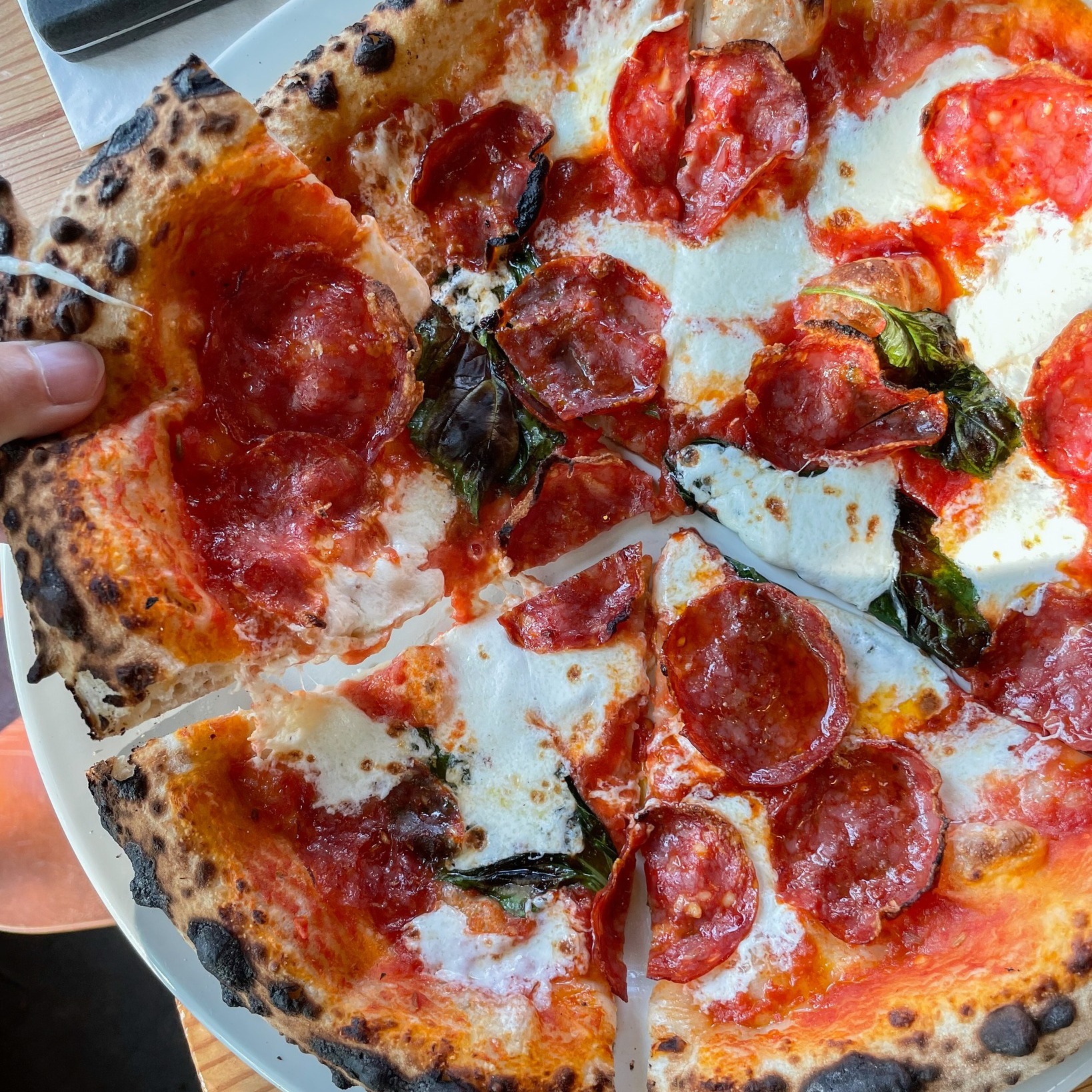 A gorgeous looking pizza with meat, sauce and cheese from Ken's Artisan Pizza in Portland Oregon.