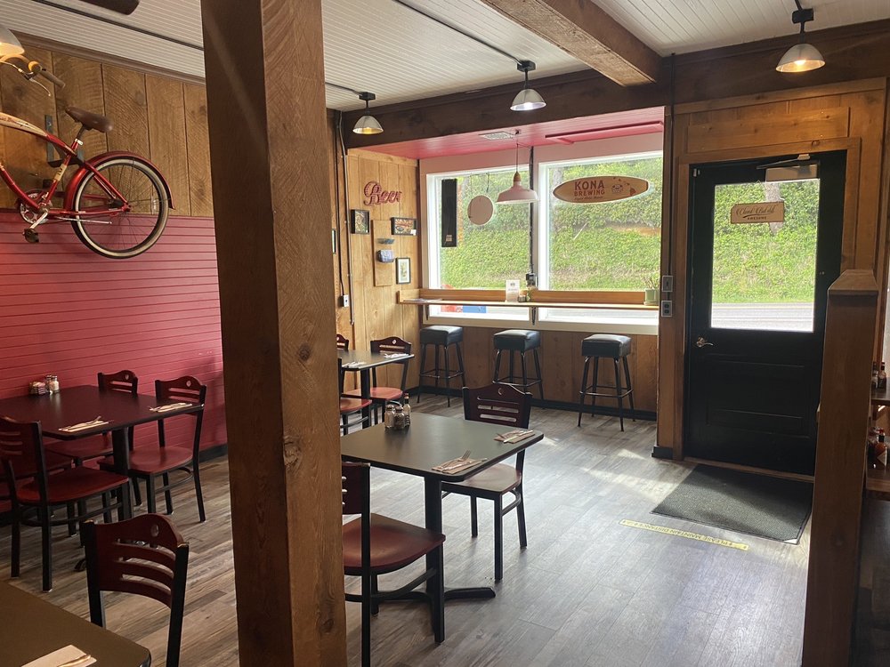 The cozy interior of Hilltop Cafe Bistro.  Warm wood tones, lots of light, and an almost cowboy vibe.