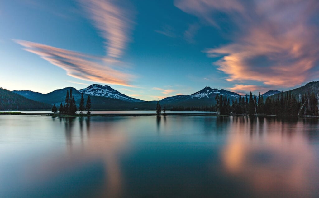 Sunset clouds and Cascade peaks reflected in Sparks Lake