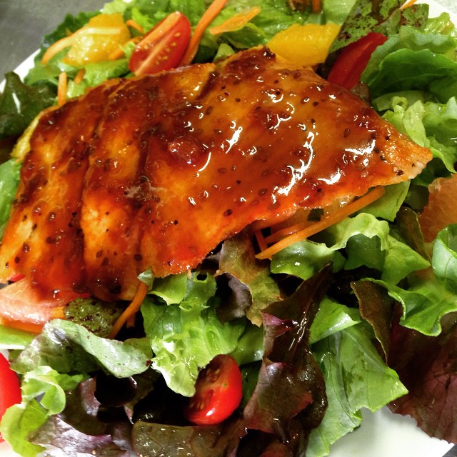 Apricot ginger teriyaki salmon on a citrus salad with fresh greens from Tumbleweed Farm.