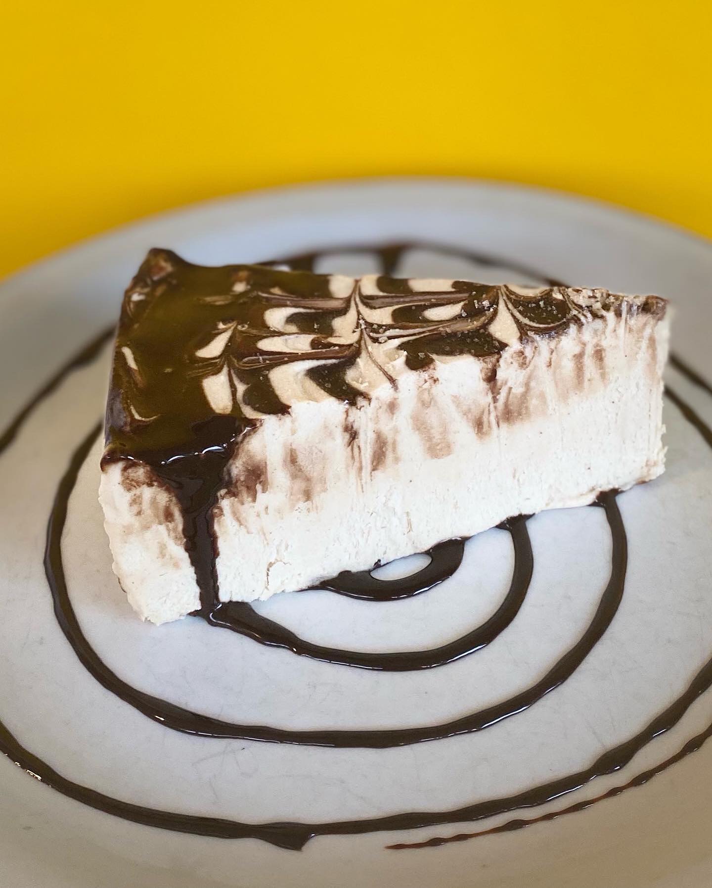 A delicious looking piece of cake at the Cornbread cafe, drizzled with chocolate sauce.