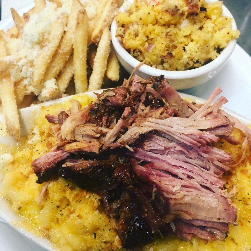Pulled BBQ meat on top of baked mac and cheese.