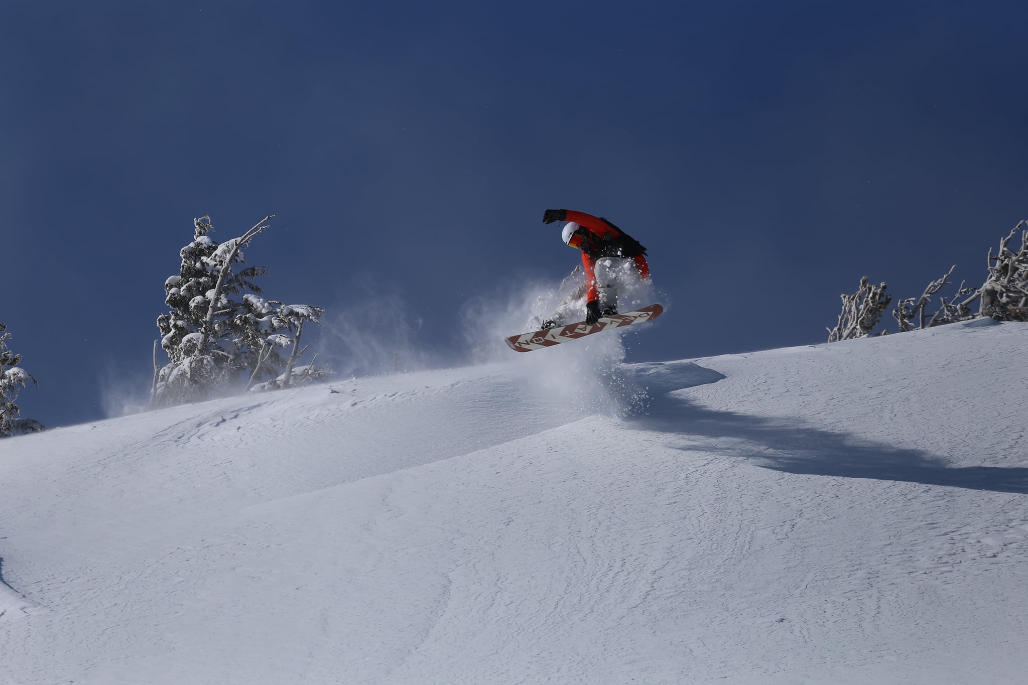 A snowboarder jumps at Mount Hood Meadows.