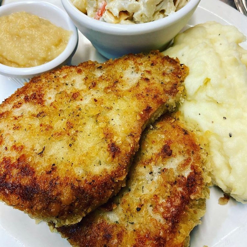 Pork chops, apple sauce and mashed potatoes.