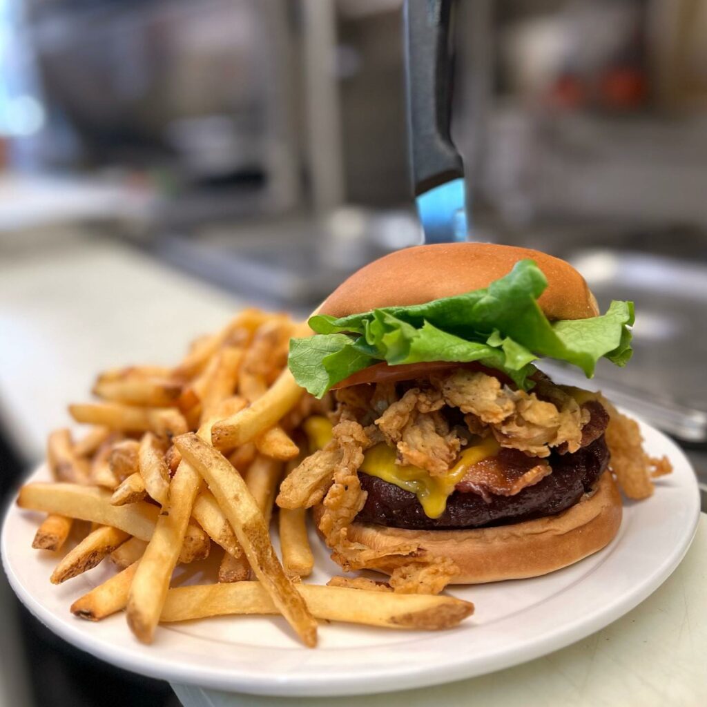 Smoked BBQ Bacon Cheeseburger with fried onions.