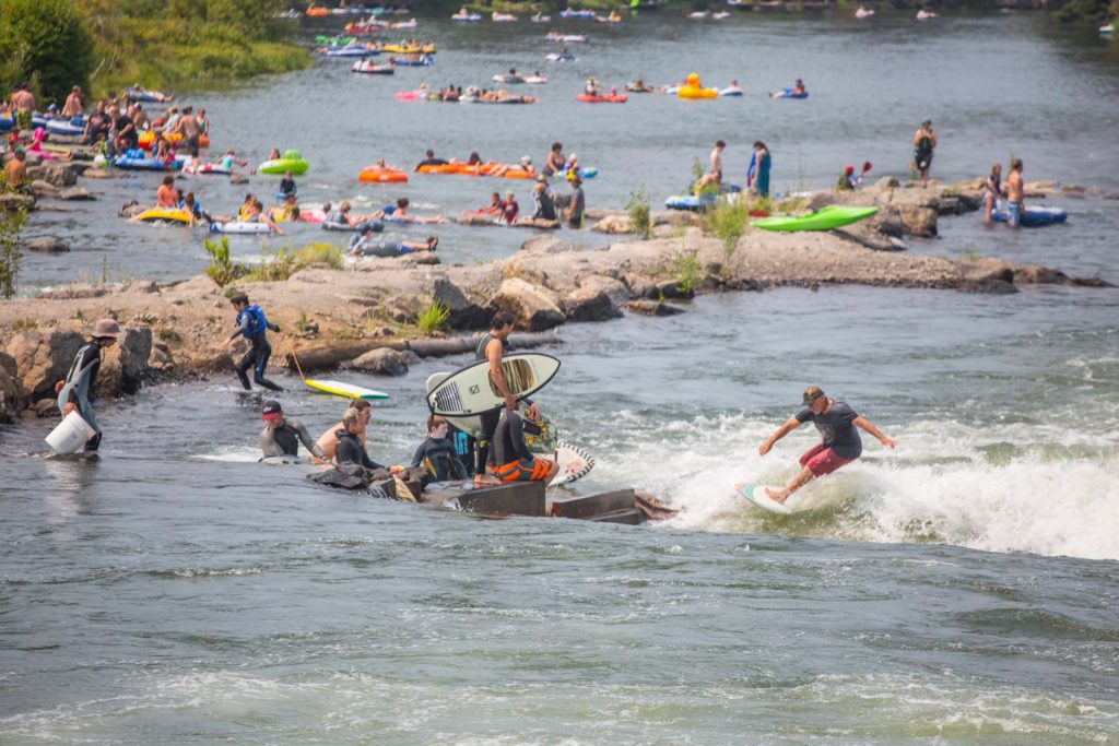 People enjoying the Bend Whitewater Park.