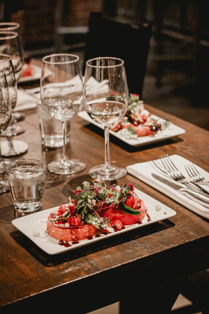 Oshen's Chophouse table with food and wine glasses