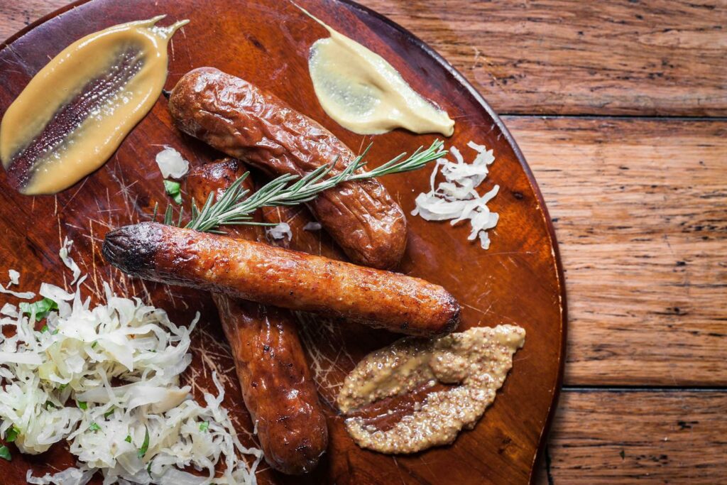 Sausages on a wooden platter at Oberon's.