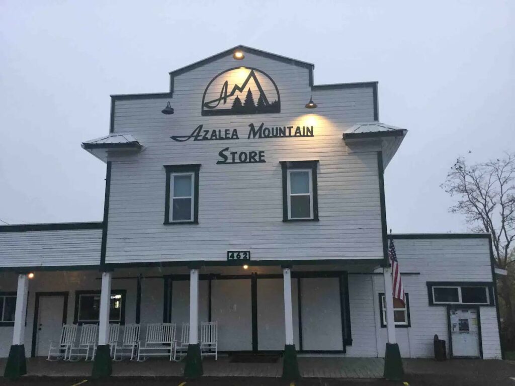 The white wood exterior of the Azalea Mountain Store.