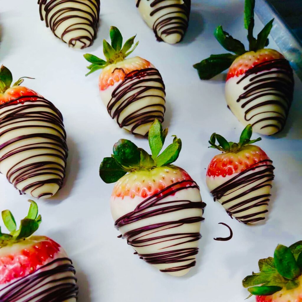 White chocolate dipped strawberries drizzled in milk chocolate