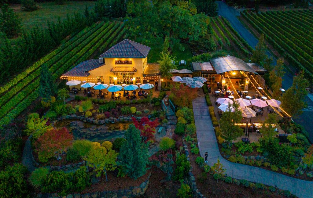 An aerial shot of Dancin Vineyards at sunset, ashland, best oregon towns, spring road trip, best towns to visit, 2024
