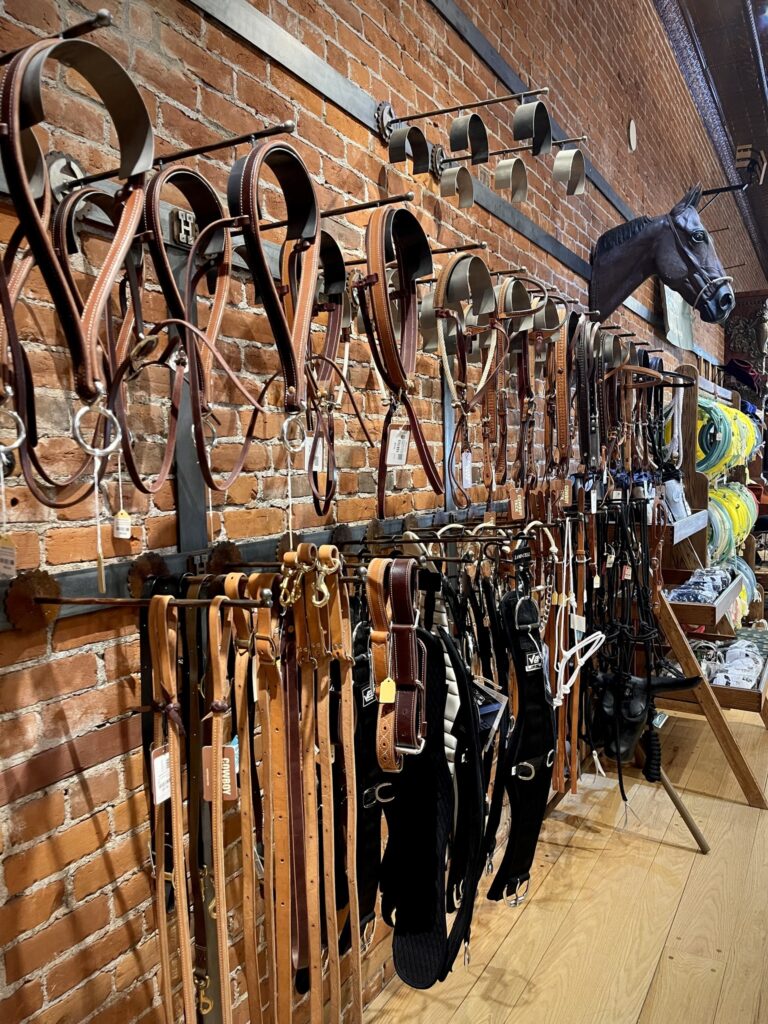 A brick wall of leather belts.