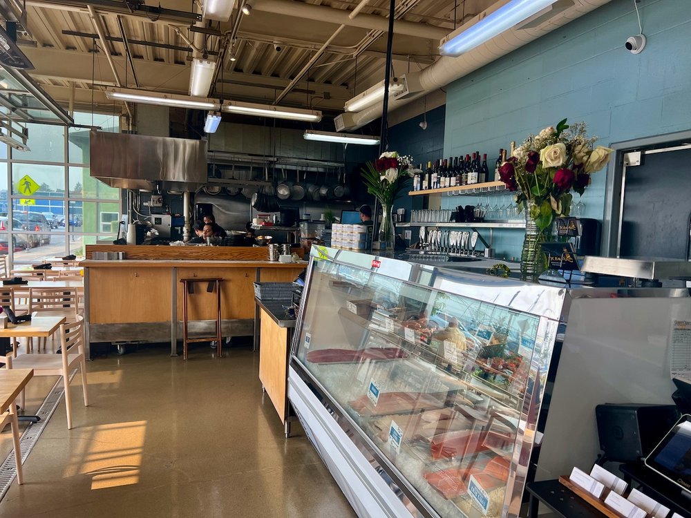 The counter and display case inside the seafood market.