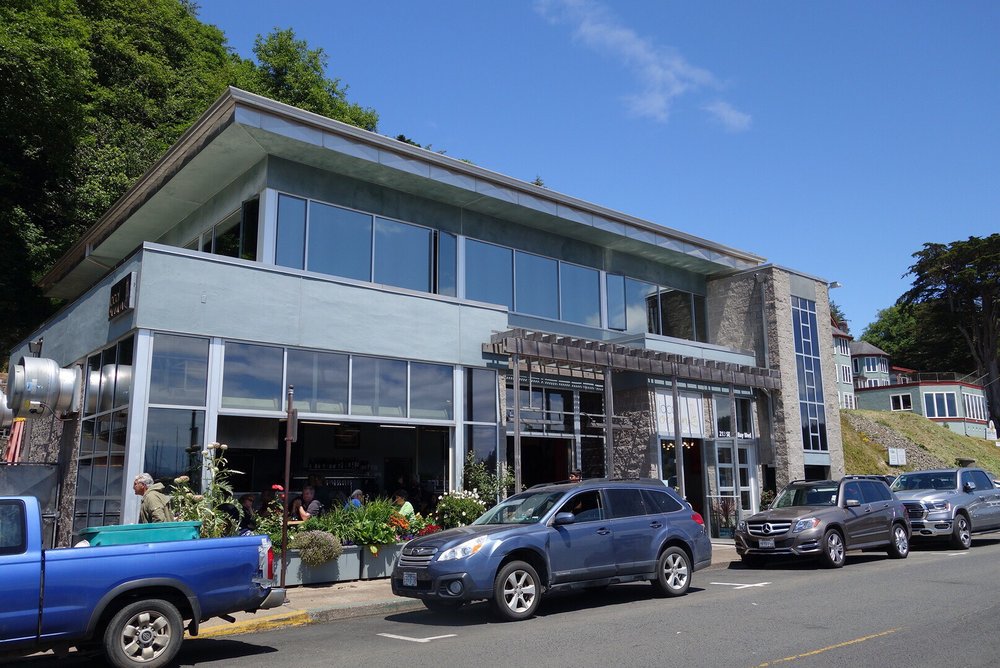 The outside of Local Ocean. It's a nice looking modern building with big glass windows overlooking the docks.