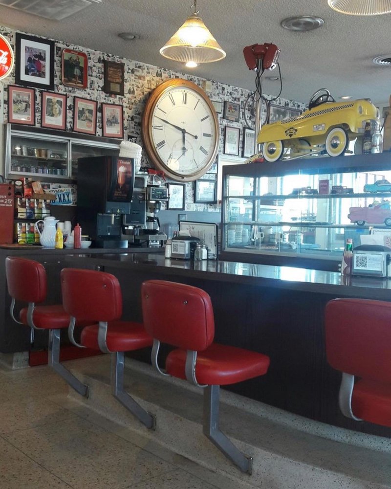 Red seats at the counter at Fin's.